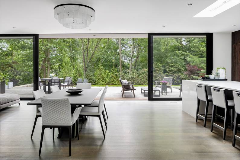 modern living room with open doorsWellesley Kitchen and Home Tour 2020, a feast for the eyes - © Jacob Lilley Architects, Wellesley, MA