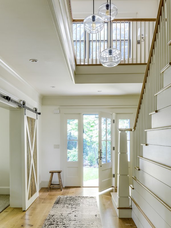 open double story wood stair© Jacob Lilley Architects Lexington, MA