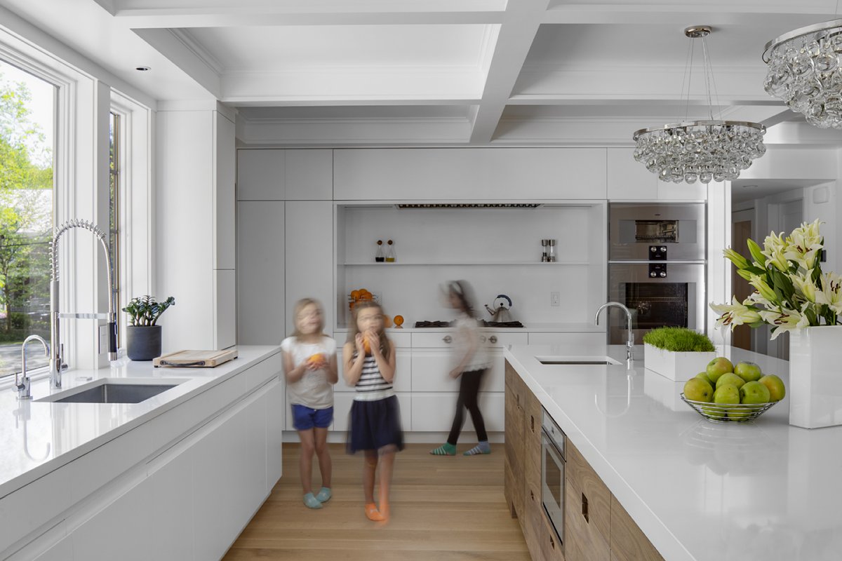 modern white kitchen with quartz counters© Jacob Lilley Architects Wellesley, MA